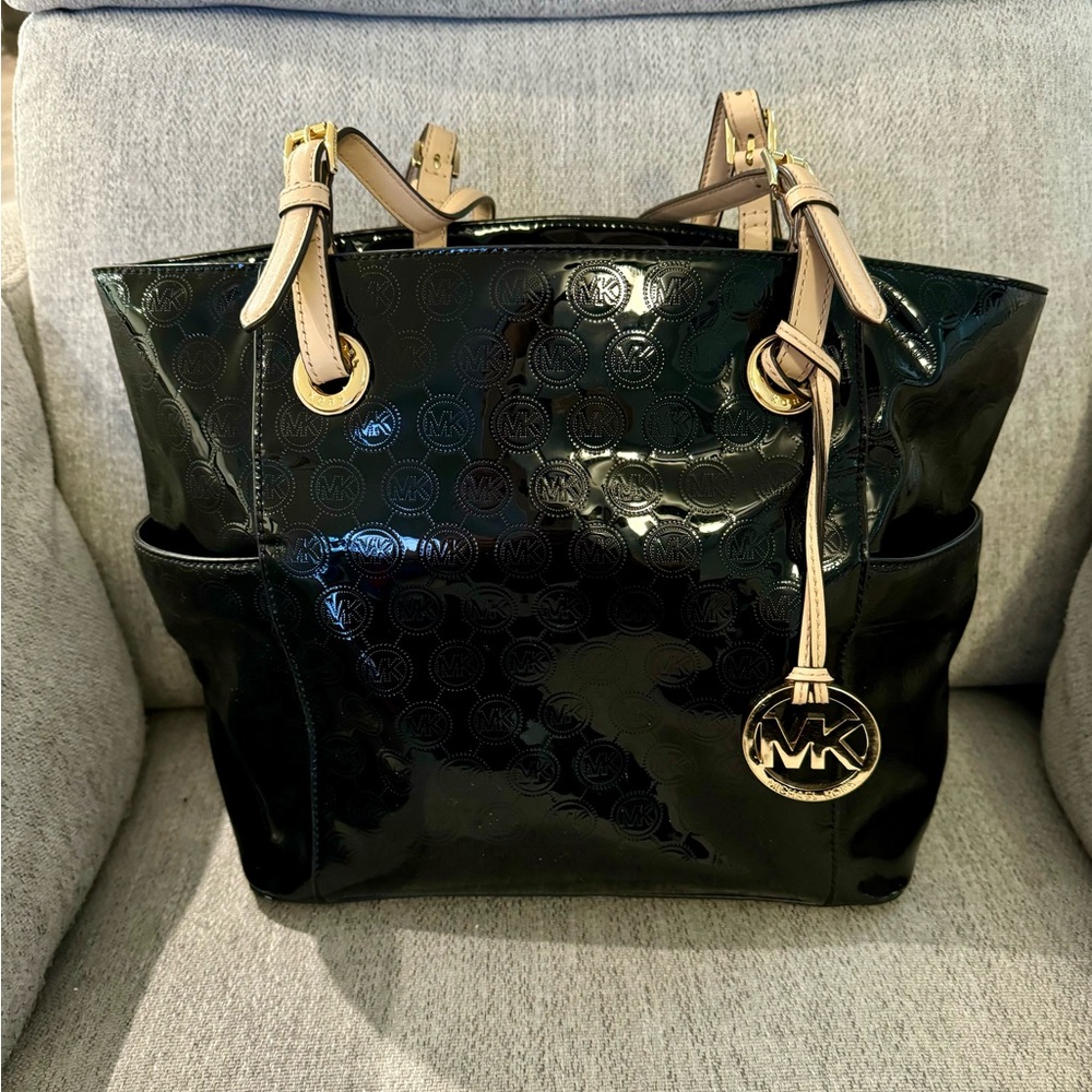 Black patent leather Michael Kors Handbag with matching wallet.